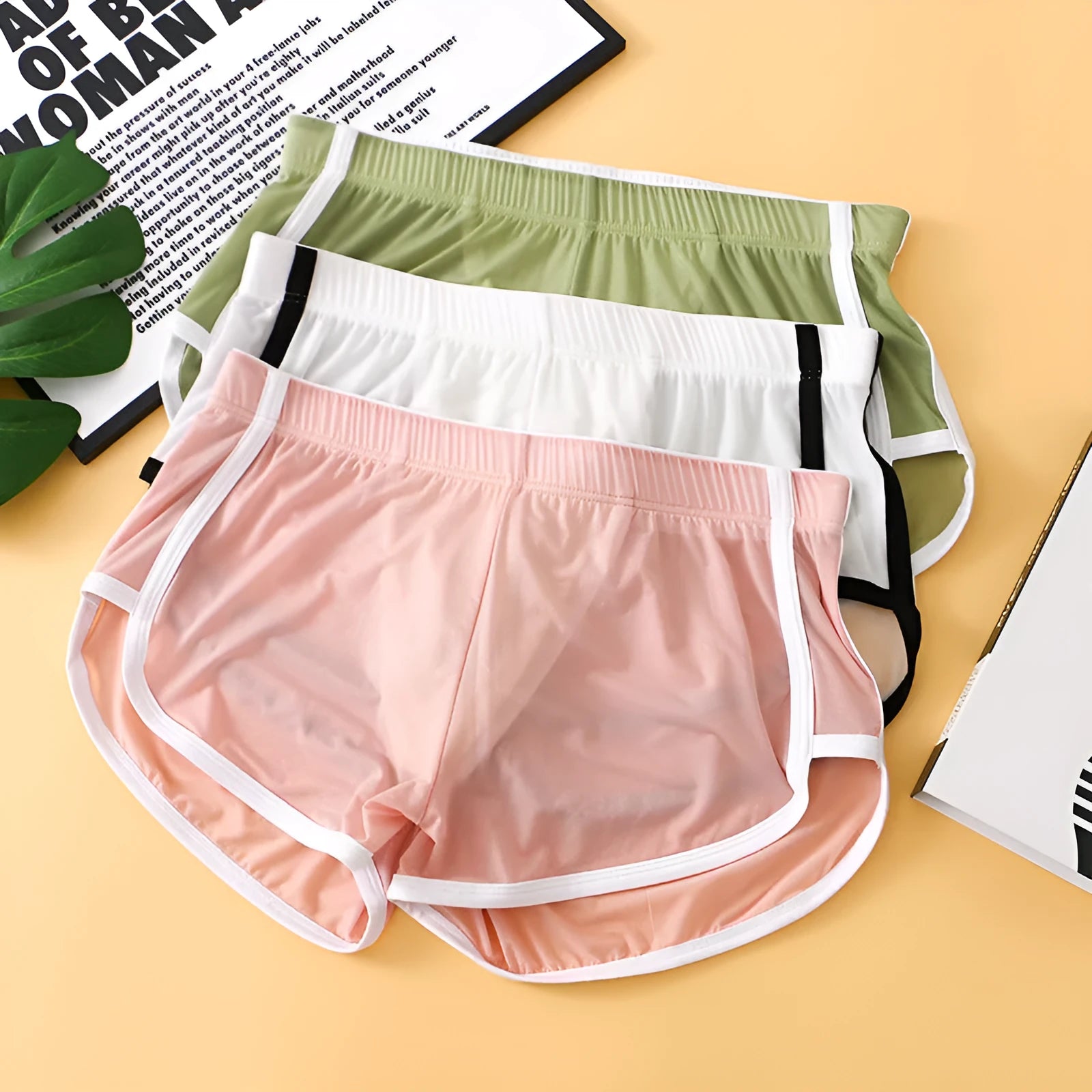 Men's ice silk nylon mesh boxer shorts in low-waist sports design, shown in multiple colours.