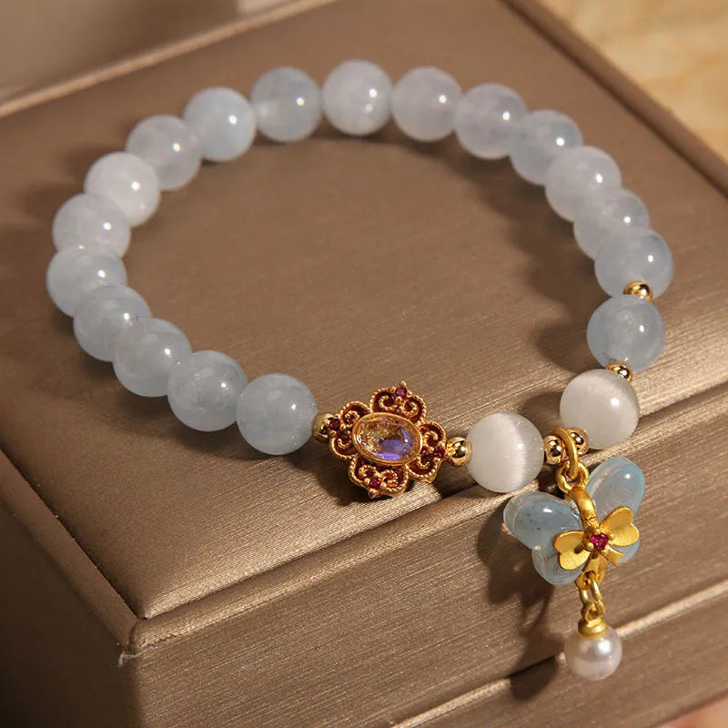 Women's aquamarine butterfly pendant bracelet with crystal and rhinestone details