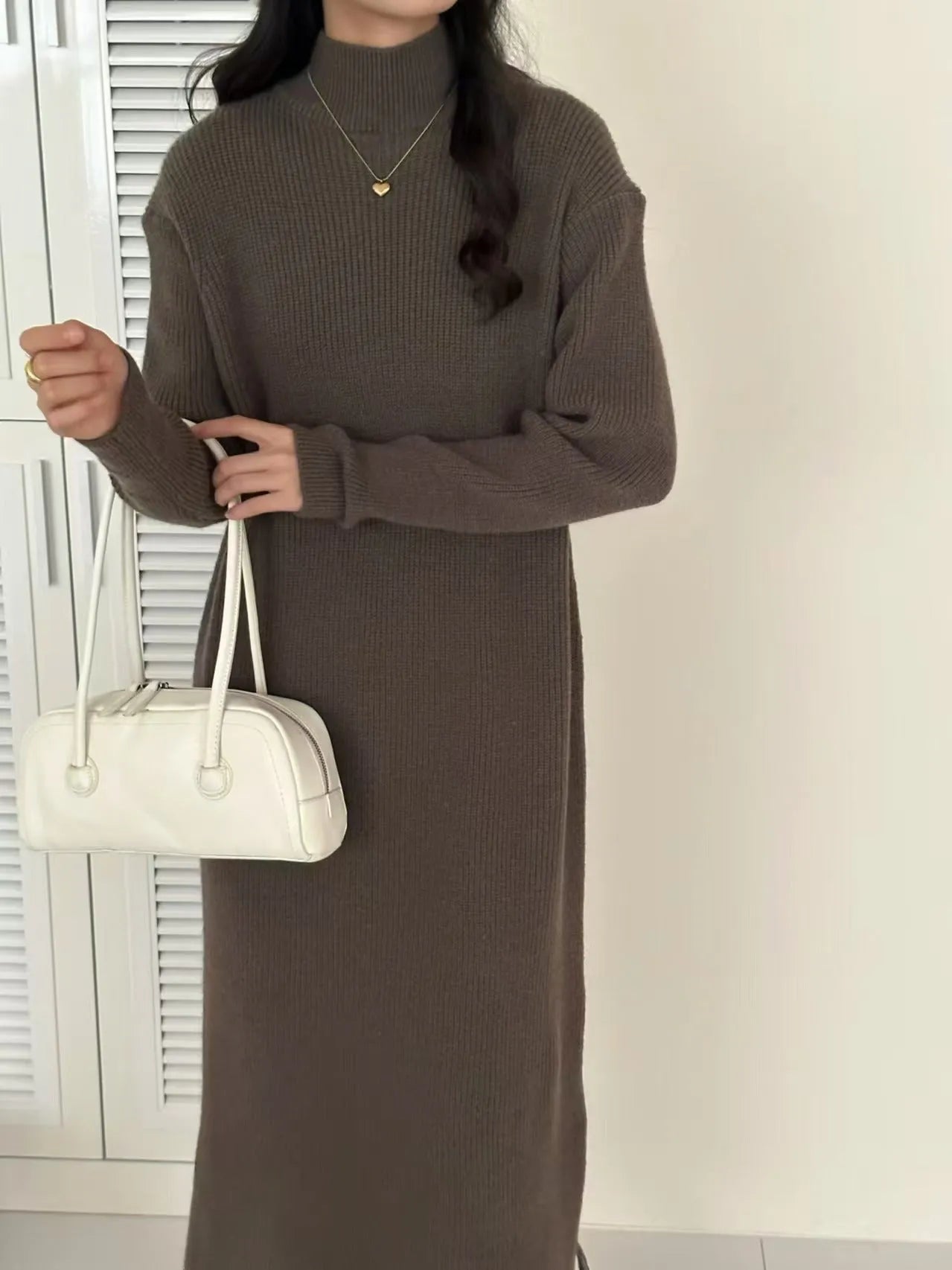 Acrylic half turtleneck knit dress in knee-length design with long sleeves