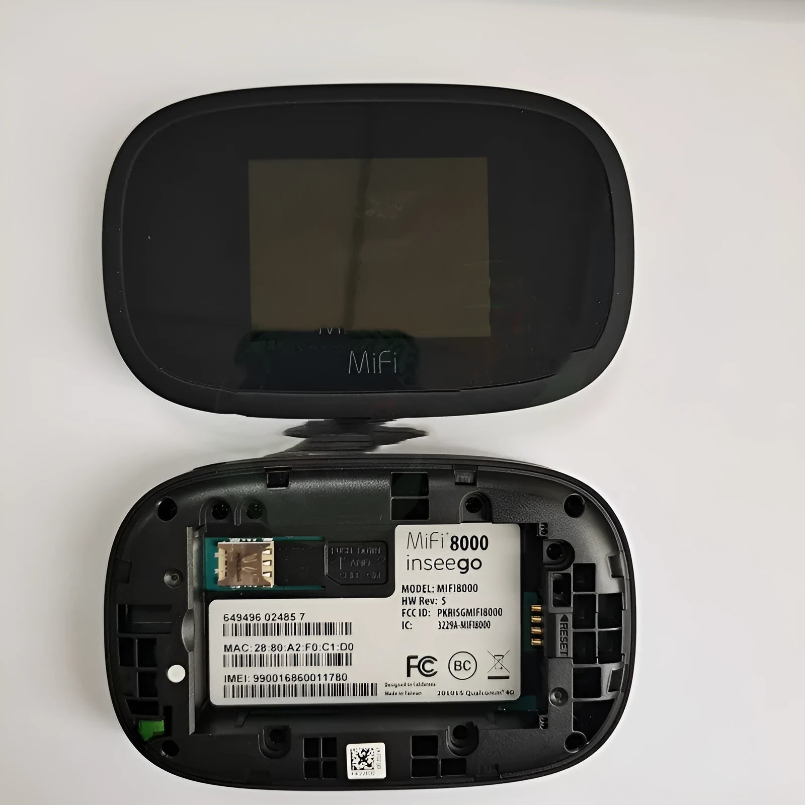 Black mifi8000 dual-core 4G portable wireless router with battery and data cable.