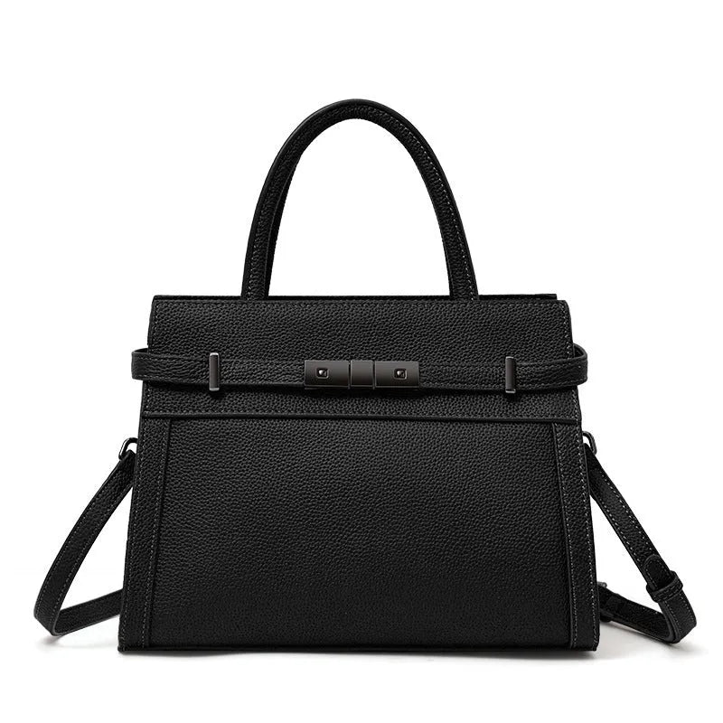 A structured square genuine leather women's crossbody bag in black, shown open to reveal internal organiser pockets.