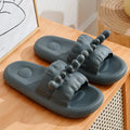 Deer horn patterned EVA flip flops for couples on a white background.