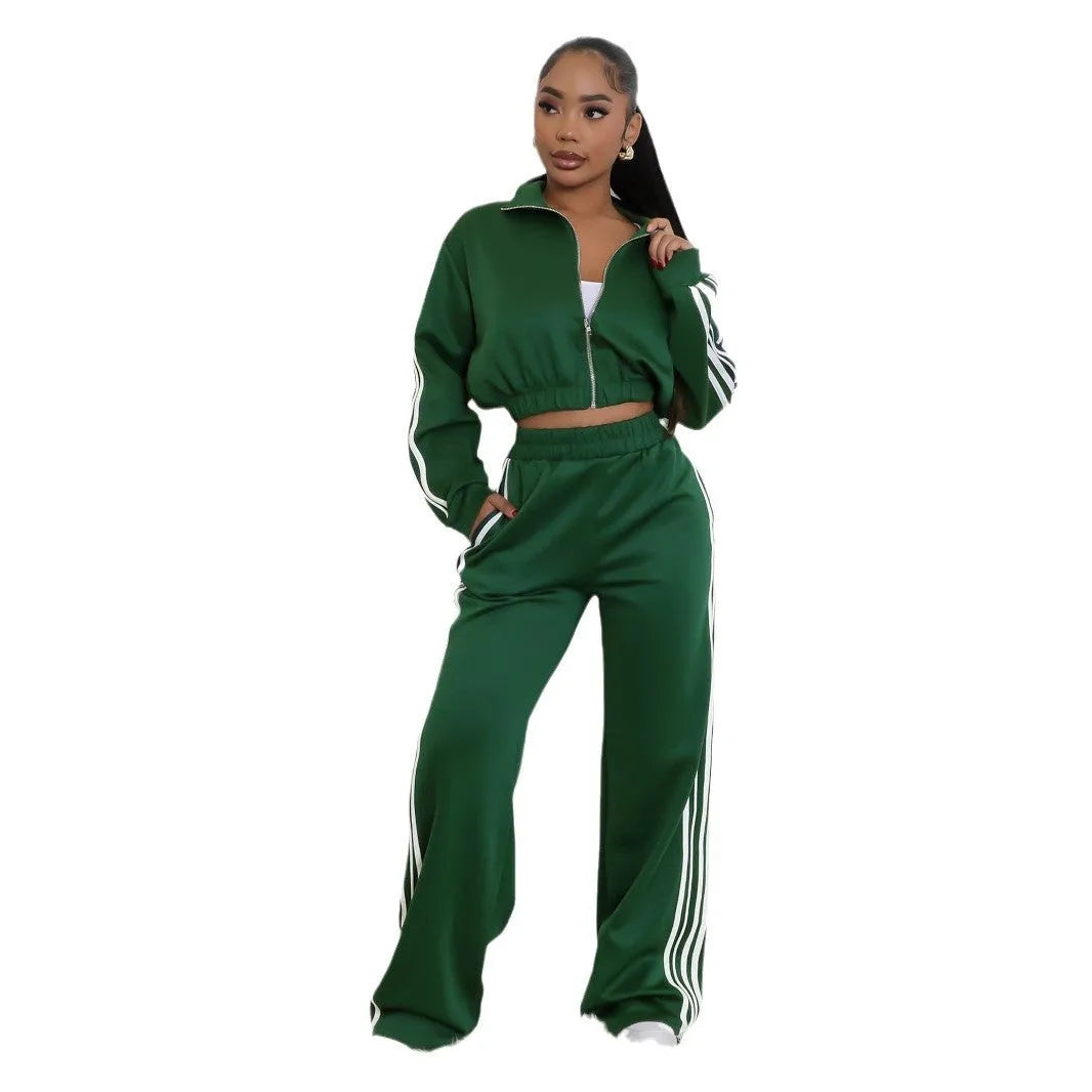 A striped grey two-piece tracksuit set with a zipper top and trousers on a mannequin.