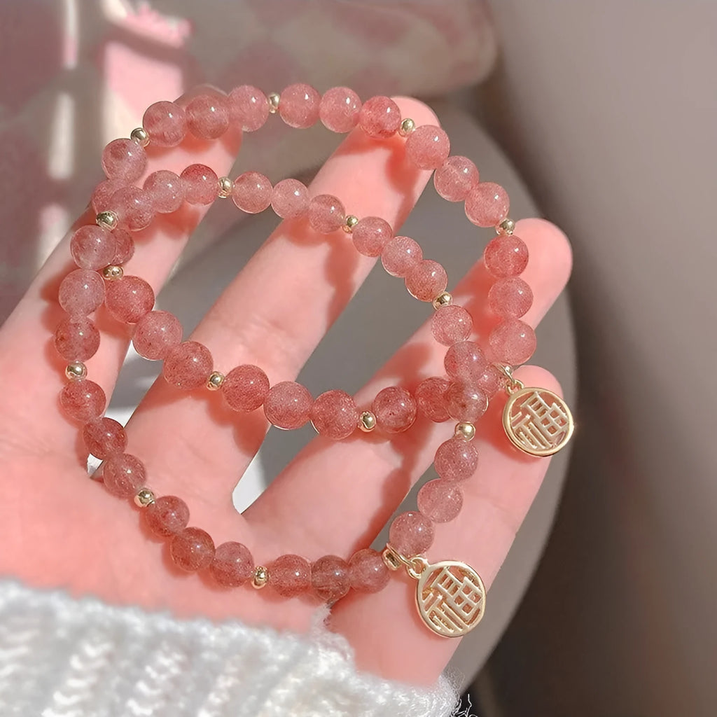 Strawberry quartz glass blessing card bracelet with adjustable clasp on wrist