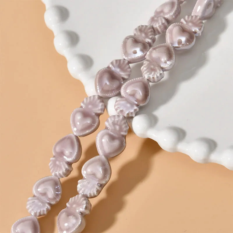 Ceramic love heart small torch shaped beads in various colours with straight holes for jewellery making