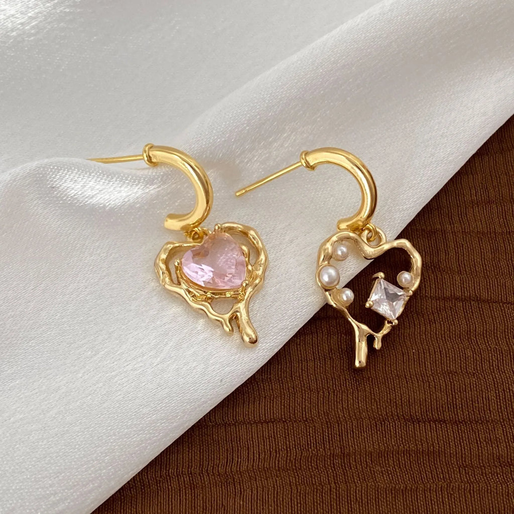 Asymmetric zircon and pearl earrings on copper heart base, light luxury style for women, available as ear clips or ear studs