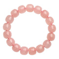 Pink crystal barrel bead bracelet with 8-10mm polished geometric beads