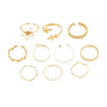 Gold-coloured openwork flower ring made from alloy with a glossy electroplated finish.