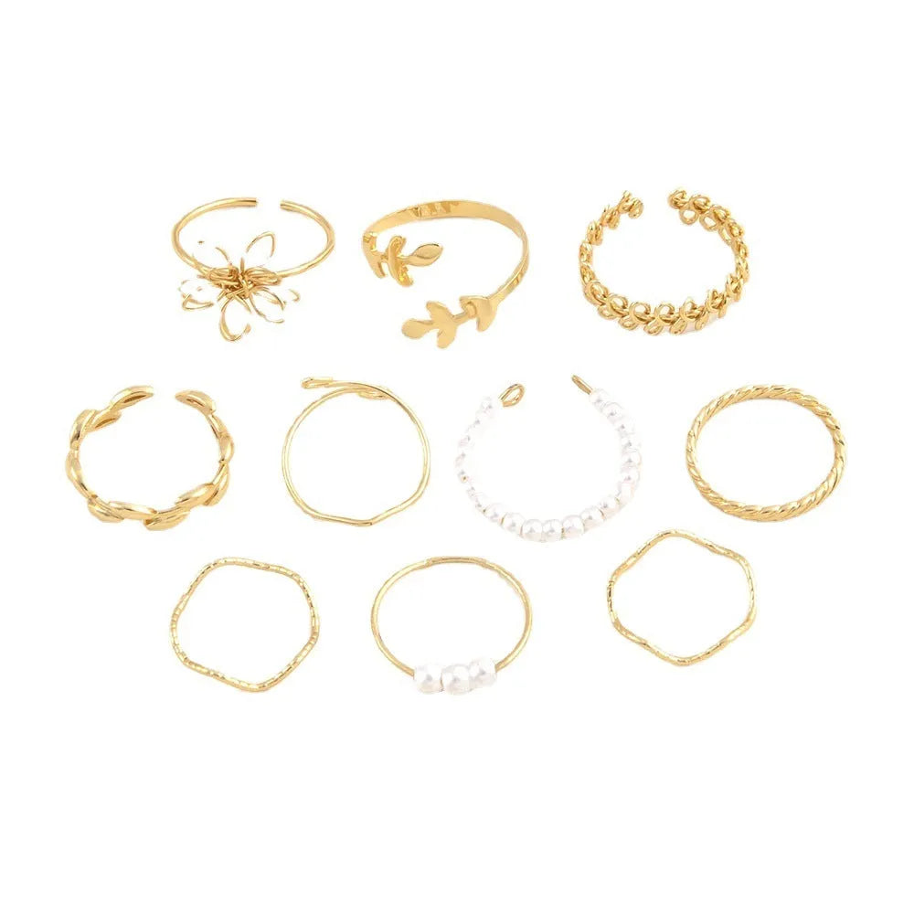 Gold-coloured openwork flower ring made from alloy with a glossy electroplated finish.