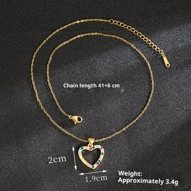 Gold light luxury necklace and earrings set with heart-shaped pendant and butterfly motif on copper alloy