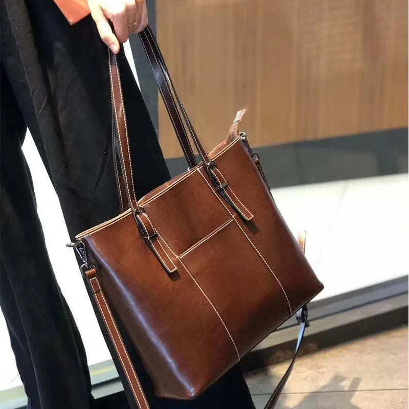 Genuine leather retro women's shoulder bag in horizontal square shape with three straps and sandwich pockets