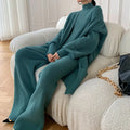 Women's apricot knitted three-piece set featuring a cardigan, sweater, and wide-leg trousers on a hanger.