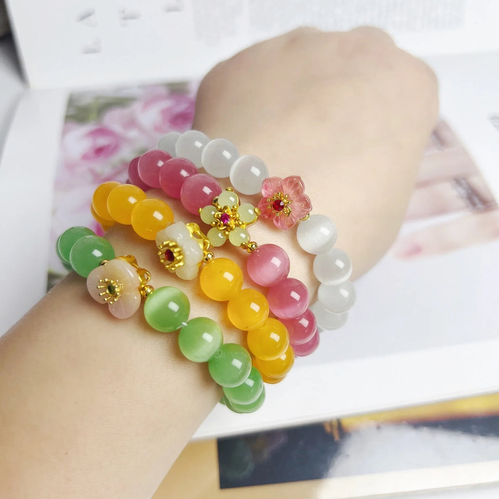 Handmade women's glass beaded bracelet with flower elements in multiple colour options