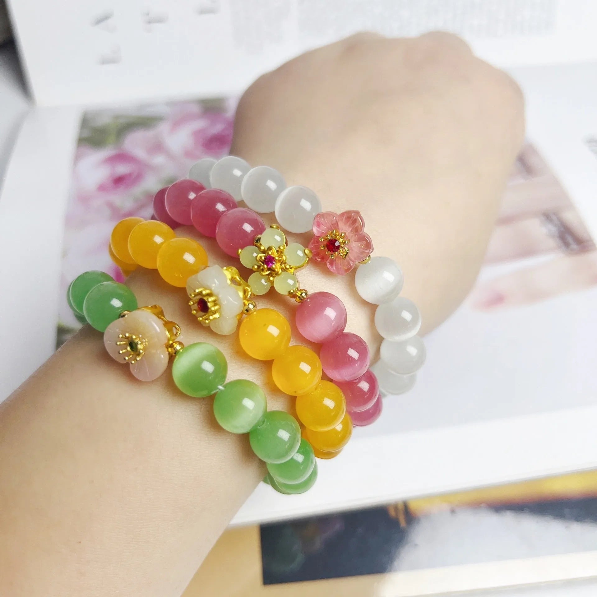 Handmade women's glass beaded bracelet with flower elements in multiple colour options