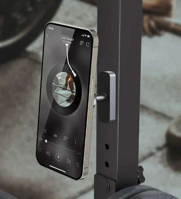 Magnetic suction mobile phone holder with silicone rubber bracket for car and gym use on iron surfaces.