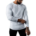 Men's tight-fit cotton sports t-shirt in army green, long sleeve, round neck.