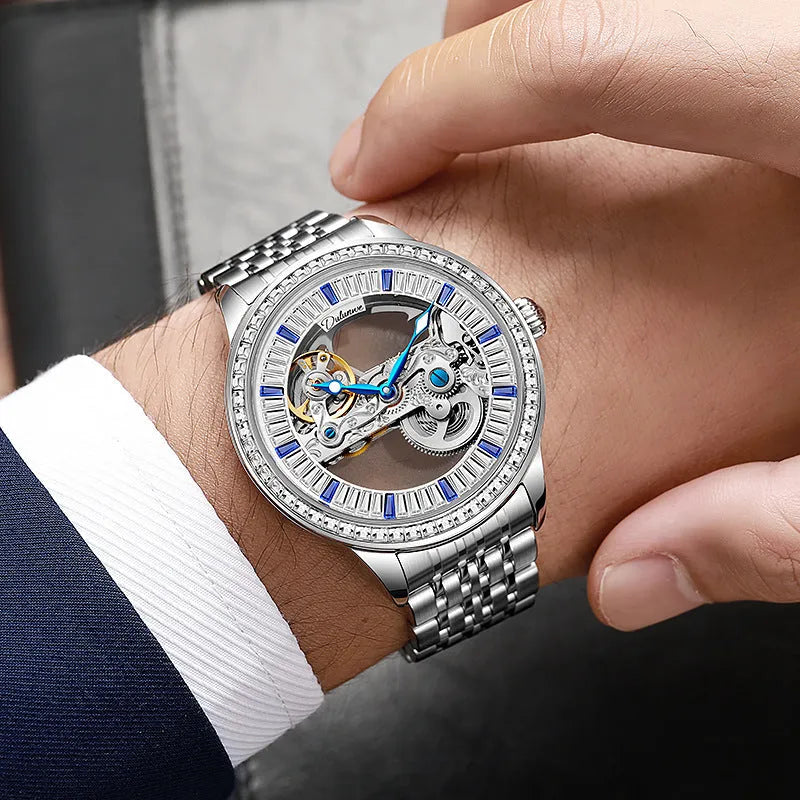 Men's zircon mechanical watch with stainless steel case and choice of strap on wrist.