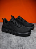 Light casual sports shoes with mesh upper and thick EVA sole in black and white colours