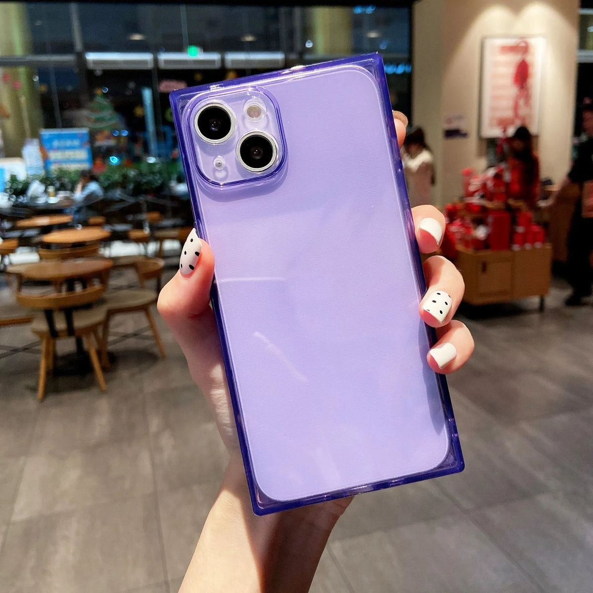 Square fluorescent TPU phone case for iPhone 13 in violet showing embossed texture and camera cutout