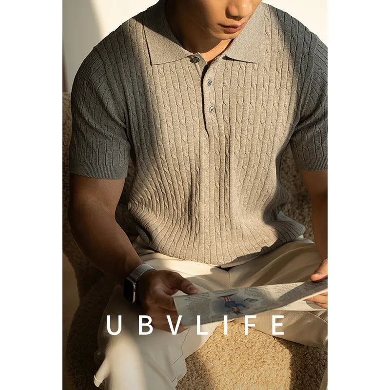 Men's khaki short sleeve business casual top laid flat, showing collar and button placket detail.