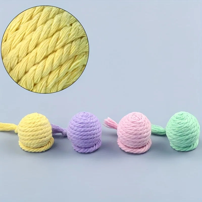Cat toy ball with attached rope in green, pink, purple or yellow colours showing 3cm and 6cm size options