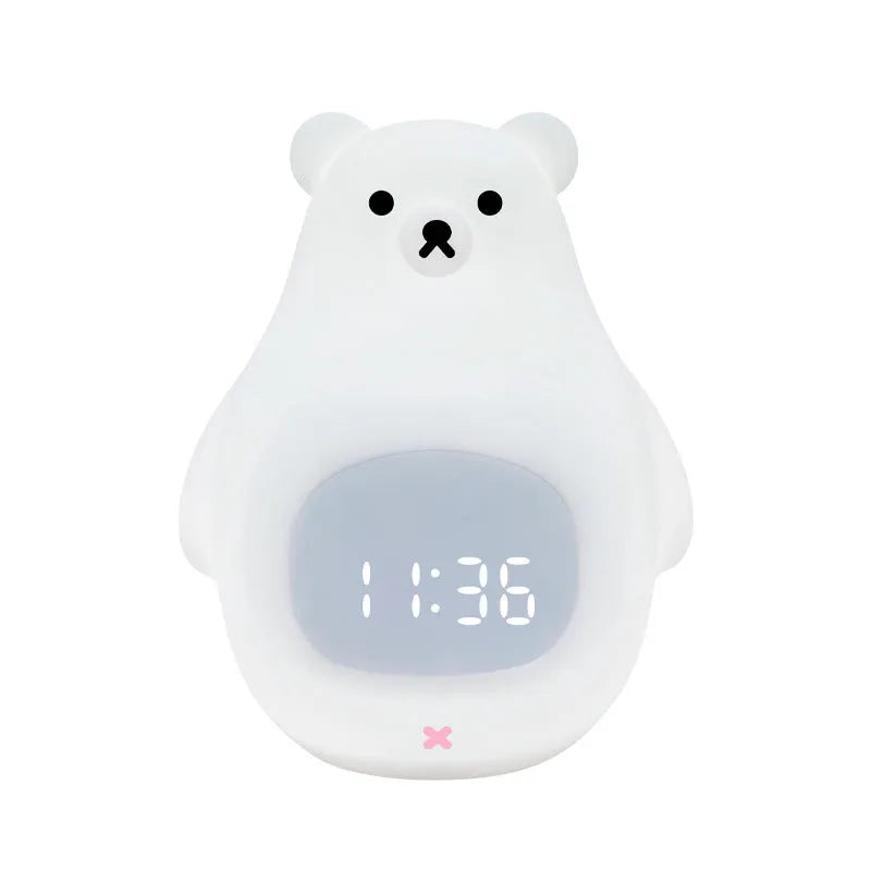 White silicone bear-shaped night light with button controls on a table.