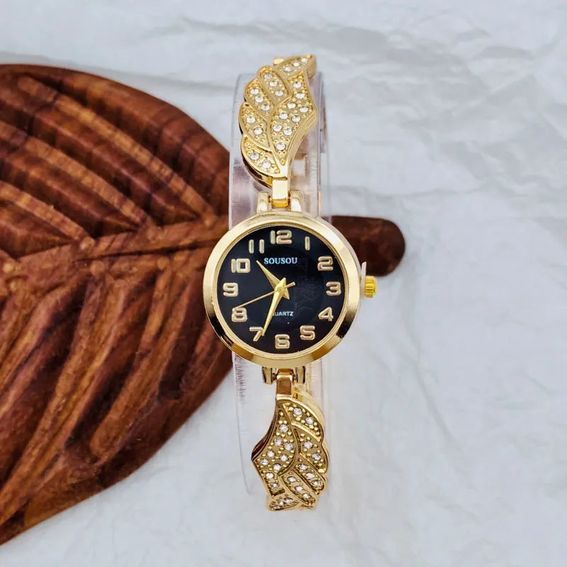 Women's round stainless steel watch with a choice of gold, golden white, or golden black dial on a steel strap with vachette clasp.