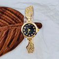 Women's round stainless steel watch with a choice of gold, golden white, or golden black dial on a steel strap with vachette clasp.