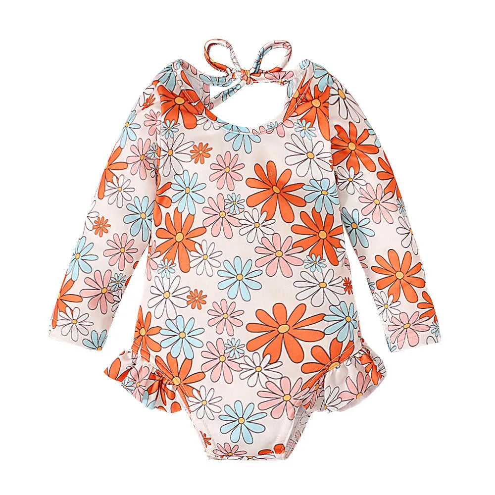 Girl's floral print swimsuit with crew neck and open back in orange red colour.
