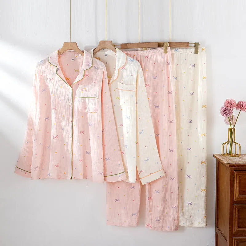 Women's long sleeve cotton pajama set in pink, featuring a crepe cloth top and trousers for homewear.