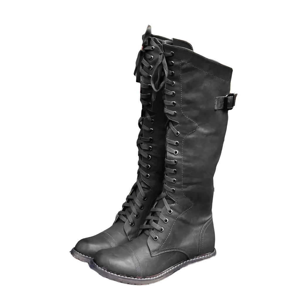Women's black artificial PU knee-high boots with cross strap design on the shaft