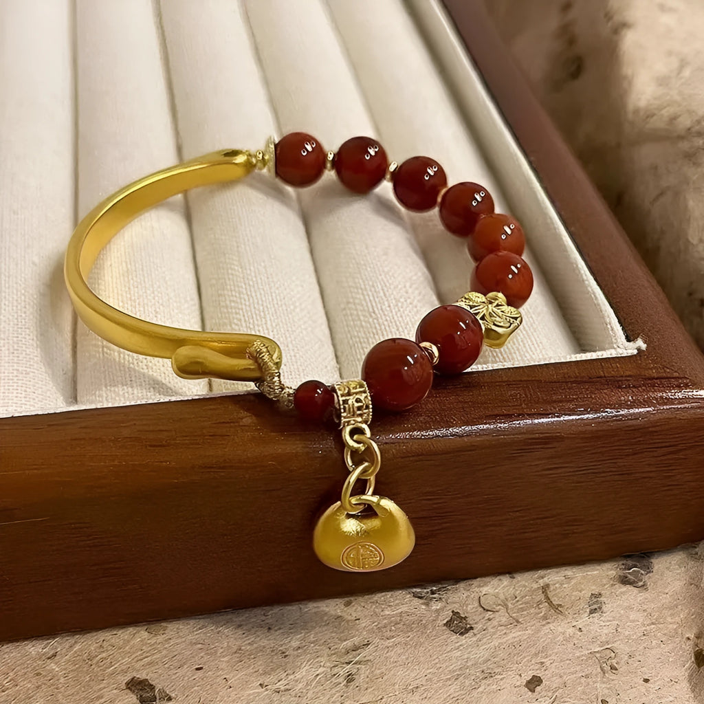 Golden south red agate character ingot bracelet with lucky bag charm design for women