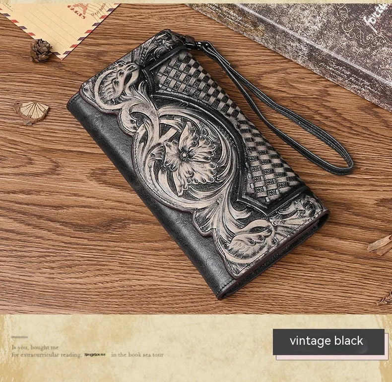 Retro brown embossed floral pattern tri-fold women's wallet made from genuine cowhide, shown open.