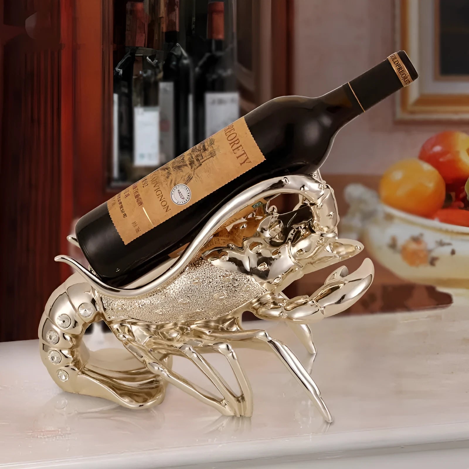 Lobster-shaped wine rack ornament in rose gold holding a wine bottle