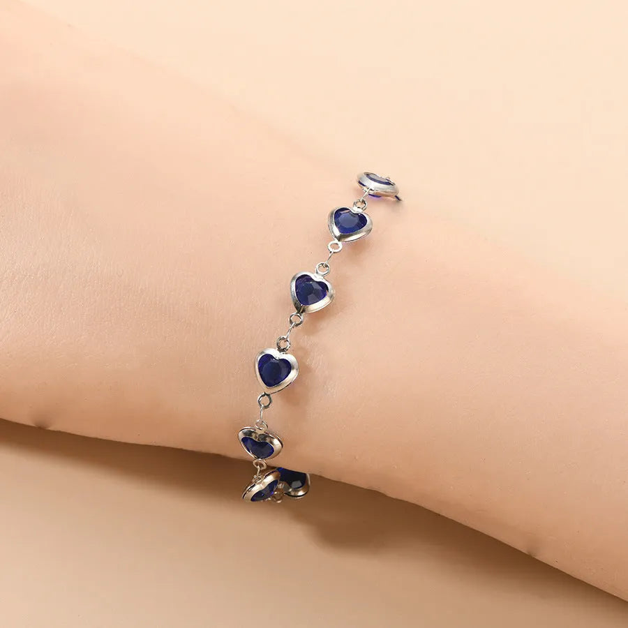 Geometry heart bracelet with devil's eye design in stainless steel showing six colour options