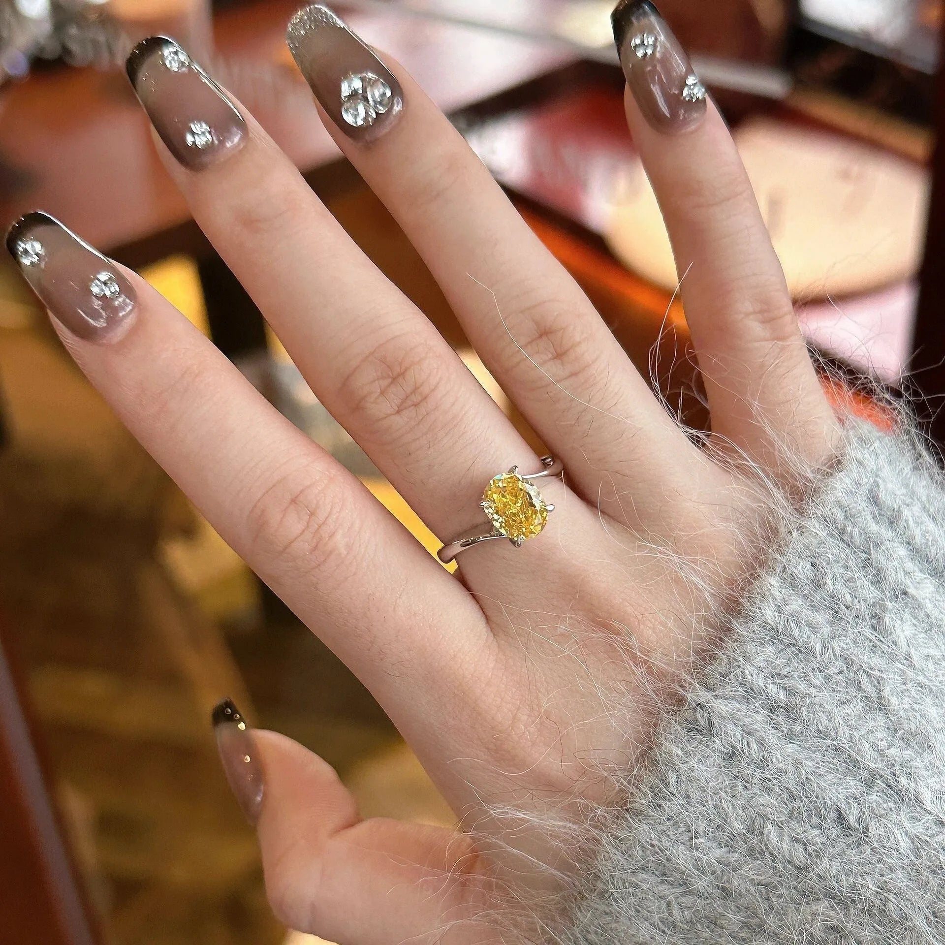 Women's yellow rock sugar crystal ring on copper with Seiko treatment showing colour and detailing