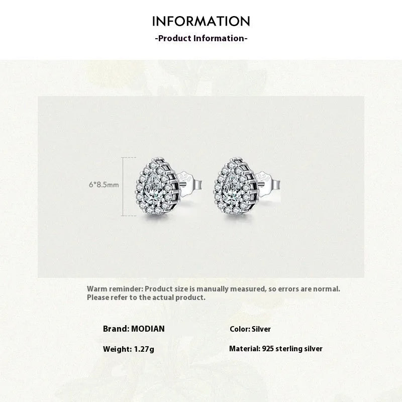 Close-up of women's silver water drop shaped ear studs made from 925 sterling silver.