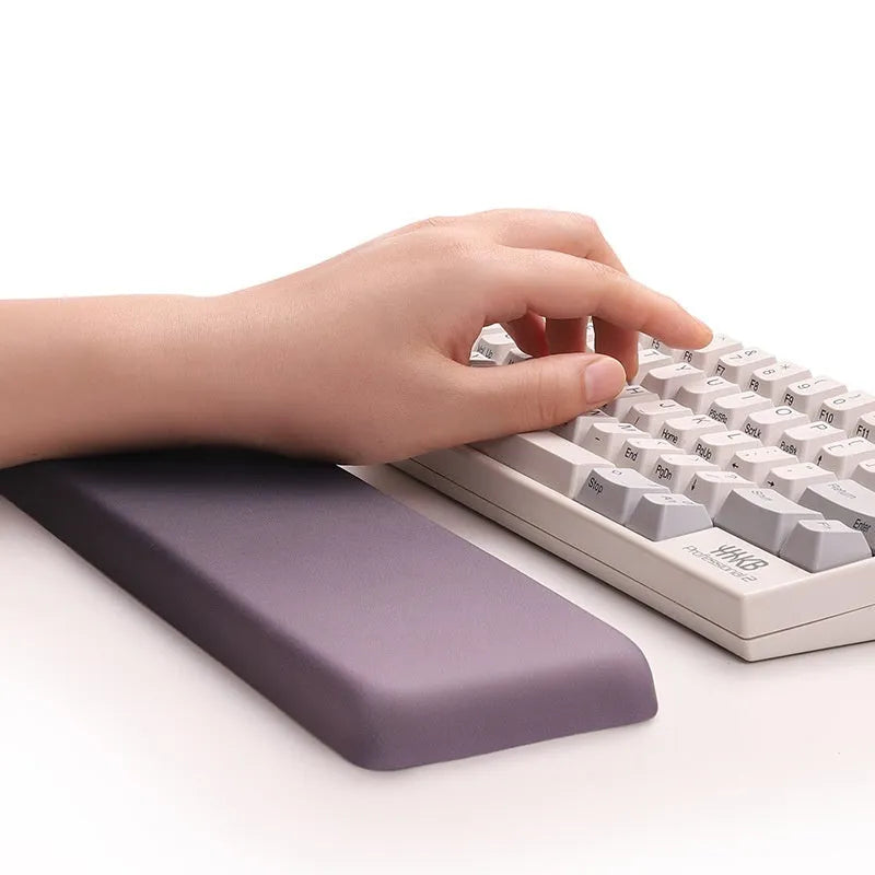 Square cloth wrist rest mouse pad with hand pillow in purple on a desk