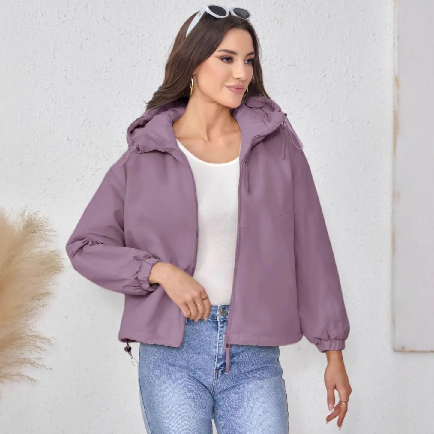 Women's hooded shell jacket in polyester available in grey, black, and purple with loose fit