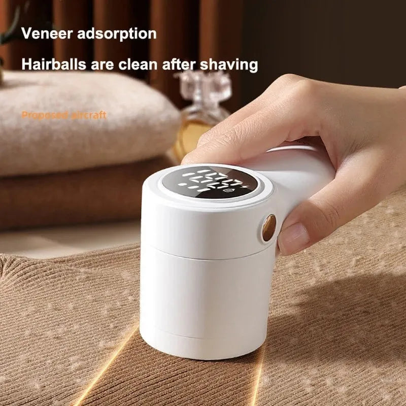 White electric lint remover with LED display showing fabric shaver dimensions