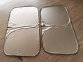 Aluminium foil car sunshade in titanium silver, shown in a rectangular shape for windscreen coverage.