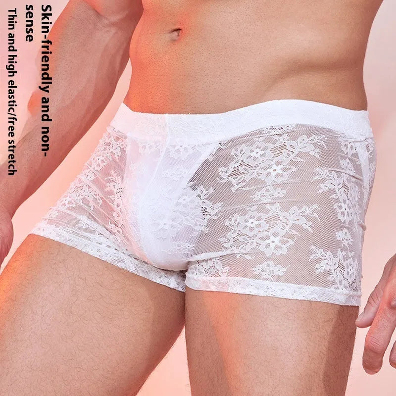 A pair of men's lace-trimmed nylon boxer shorts on a white background, shown in black colour.