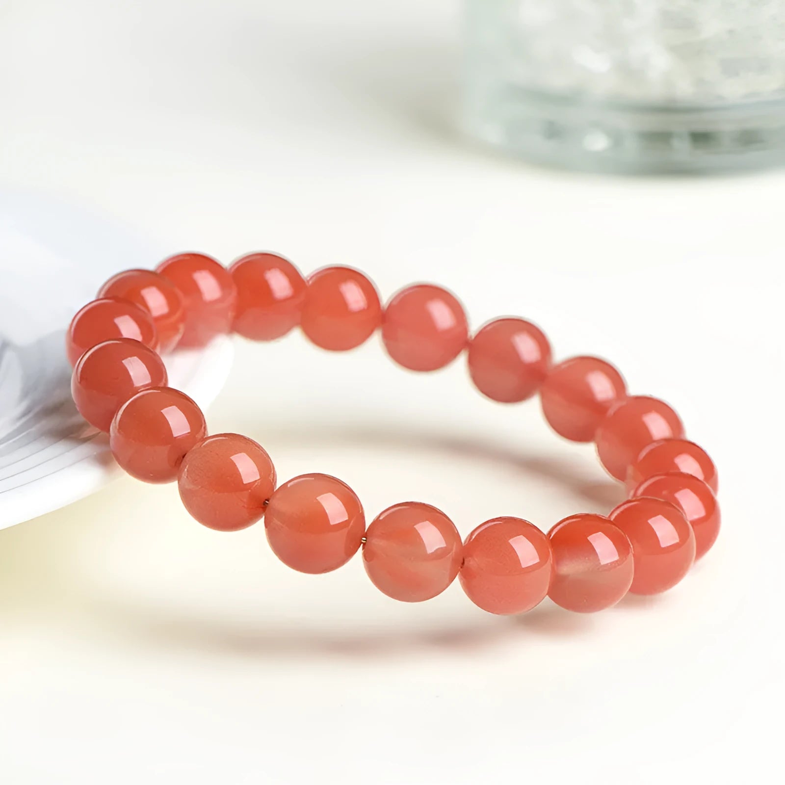 Natural south cherry red agate bracelet showing single and triple strand design options with different bead sizes.
