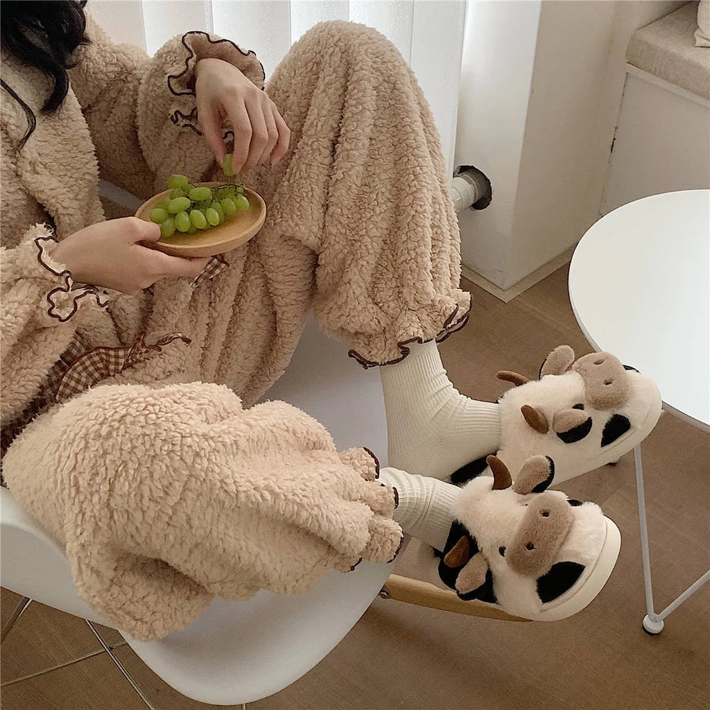 White cartoon cow slippers for women with soft faux fur and textured anti-slip soles