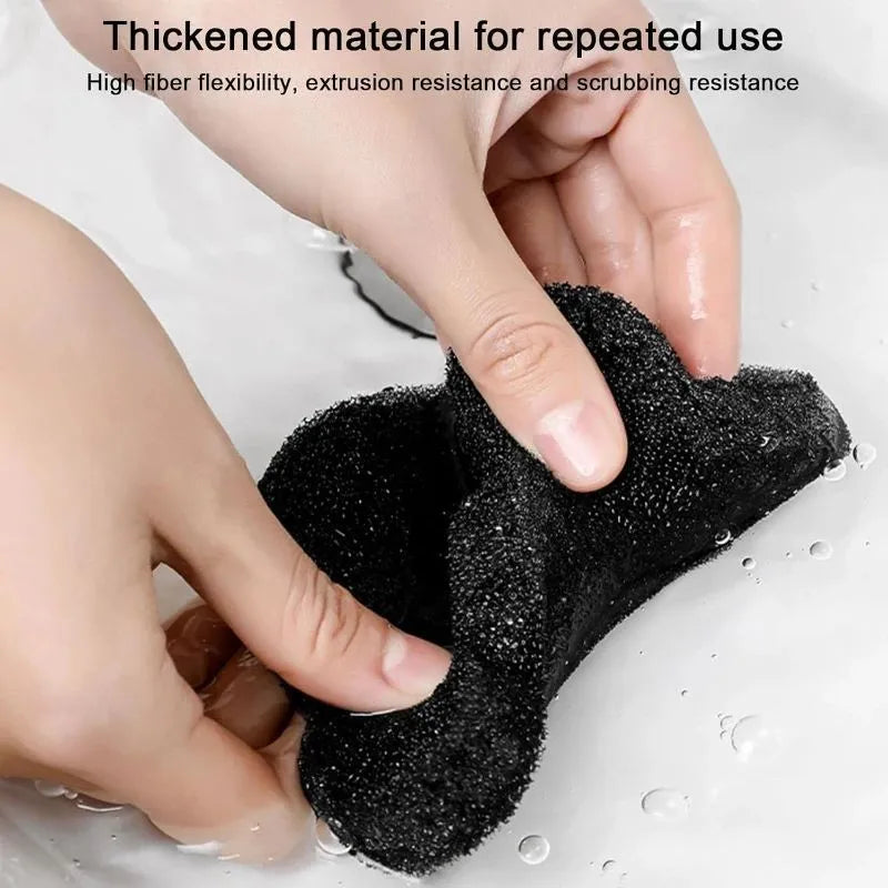 Two black bear-shaped sponge cleaning balls for pet hair removal in laundry