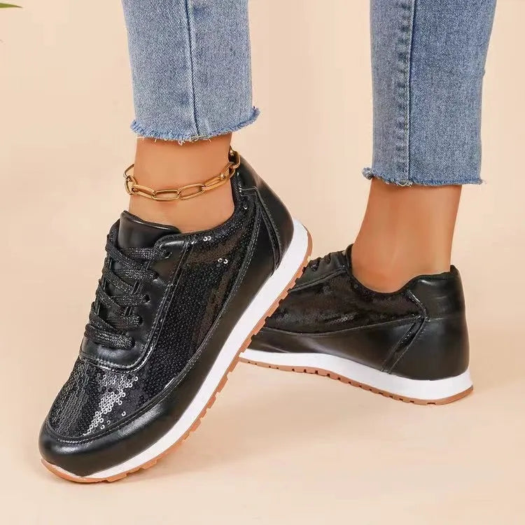 Women's thick-soled black PU leather sneaker with a square toe on a white background.