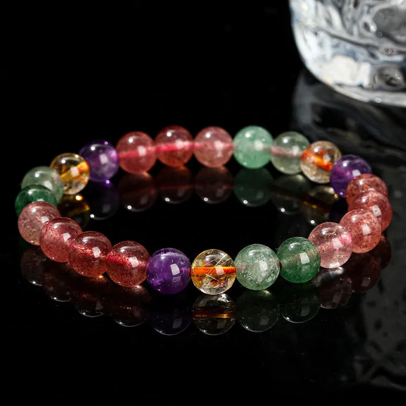 Natural strawberry quartz gemstone bracelet with round geometric beads.