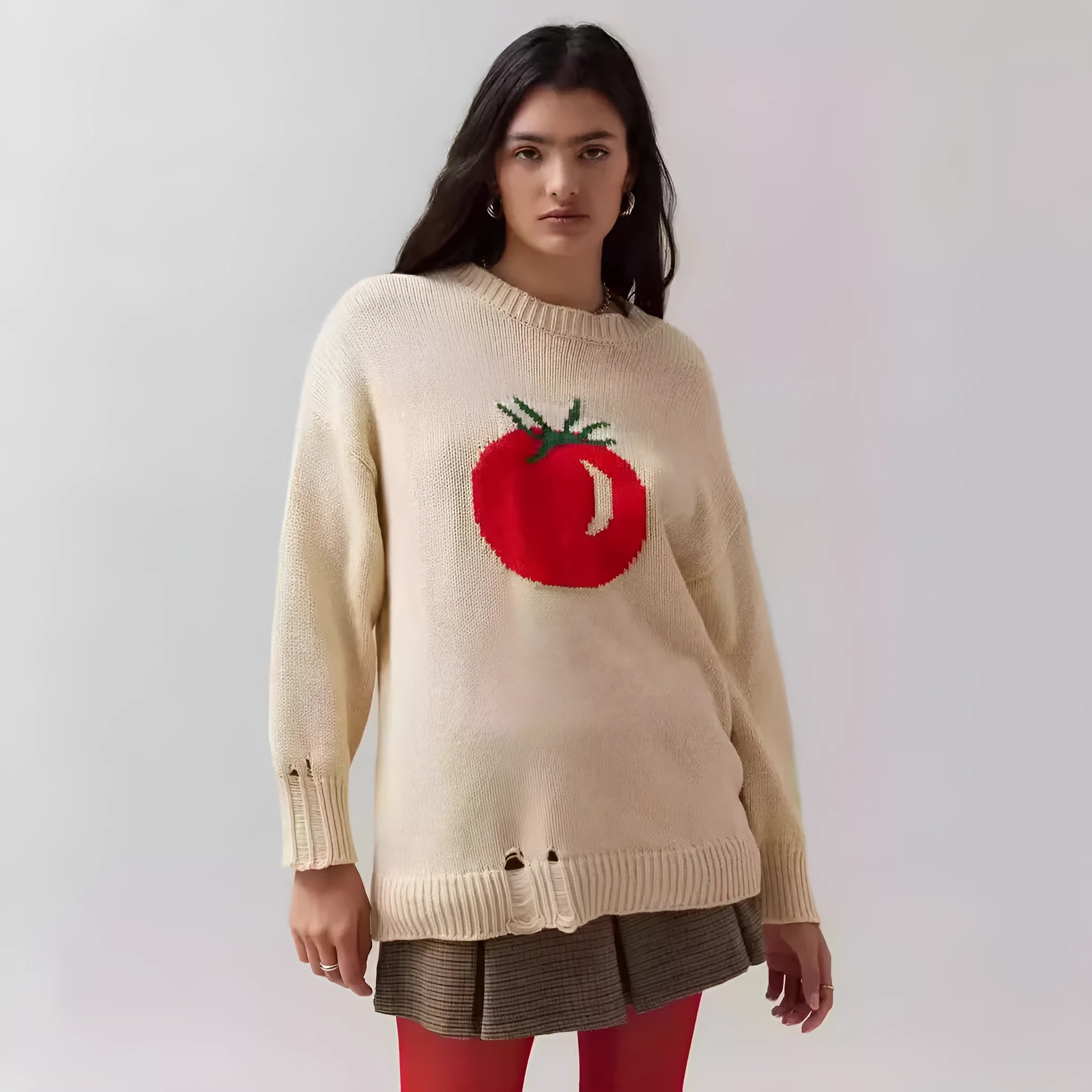 Milky white women's jacquard knit pullover sweater with a round neck and long sleeves on a hanger.