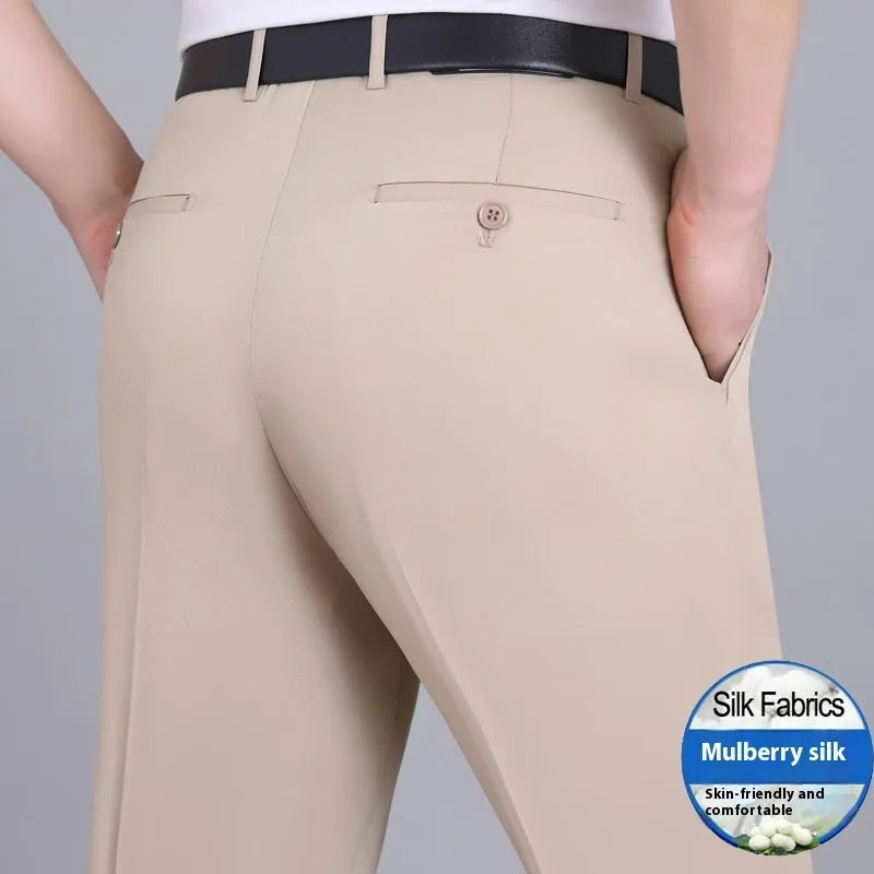 Men's straight-leg suit trousers in mulberry silk fabric on a hanger