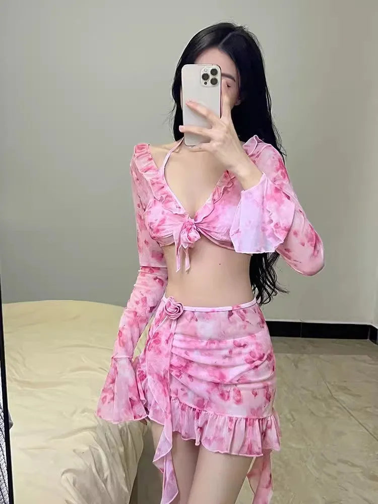 Women's cherry blossom pink floral print bikini swimsuit set on a white background